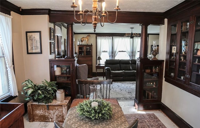 561 W Washington Ave, Elmira City, NY 14901 - dining room featuring ornate columns, a chandelier, crown molding, and wood finished floors