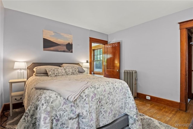 49 Mang Ave, Tonawanda, NY 14217 - bedroom with radiator heating unit and wood finished floors