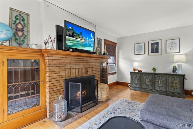 49 Mang Ave, Tonawanda, NY 14217 - living room featuring a brick fireplace and wood finished floors