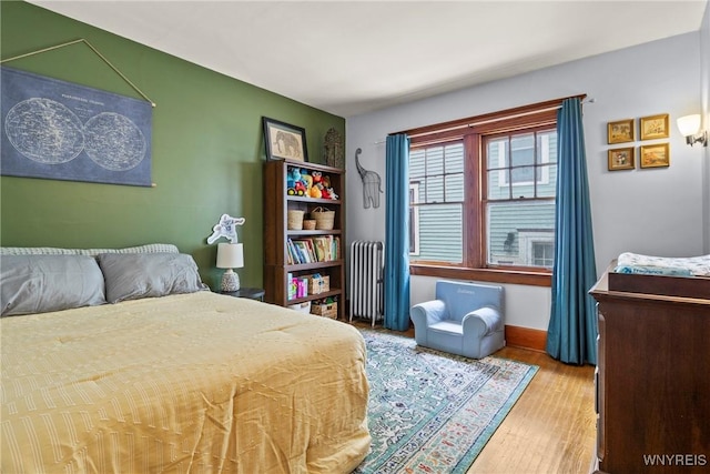 49 Mang Ave, Tonawanda, NY 14217 - bedroom featuring radiator heating unit and wood finished floors