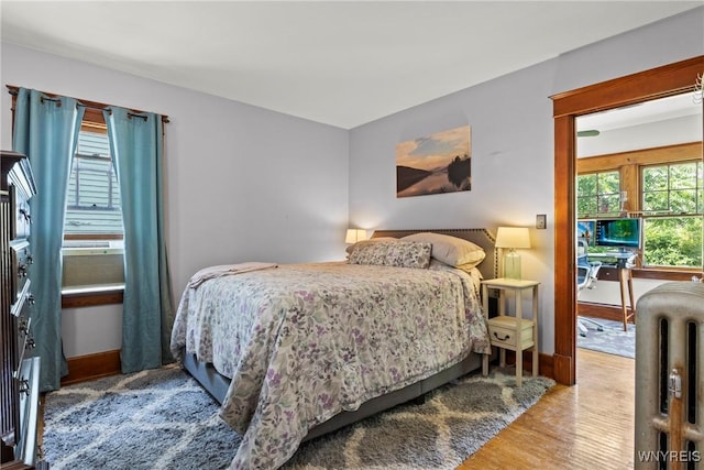 49 Mang Ave, Tonawanda, NY 14217 - bedroom with wood finished floors, radiator, and cooling unit