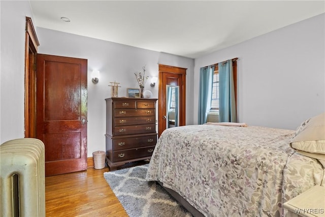 49 Mang Ave, Tonawanda, NY 14217 - bedroom featuring radiator heating unit and light wood finished floors