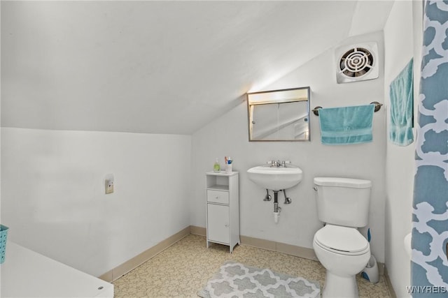 49 Mang Ave, Tonawanda, NY 14217 - bathroom featuring lofted ceiling and toilet