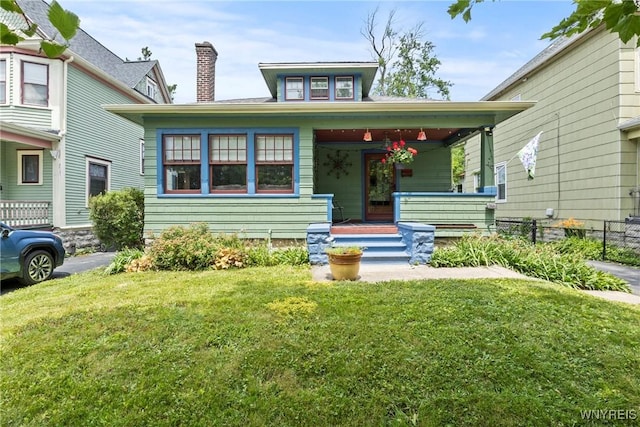 49 Mang Ave, Tonawanda, NY 14217 - view of front of home featuring covered porch and a chimney