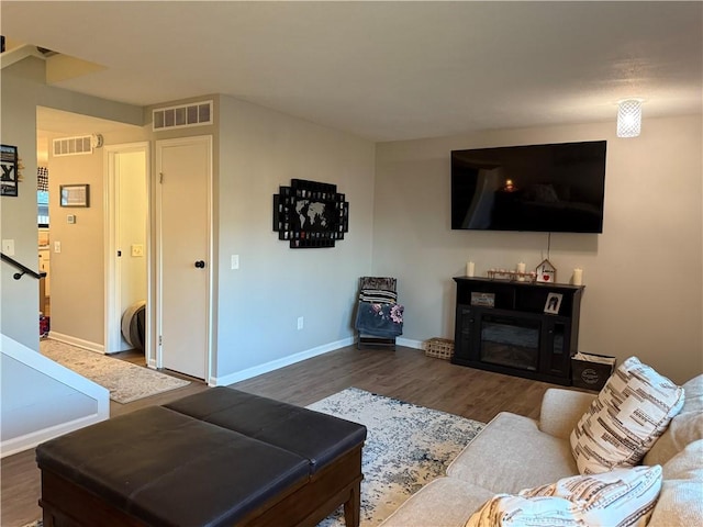 157 New Wickham Dr, Penfield, NY 14526 - living room featuring dark wood-style floors and a glass covered fireplace