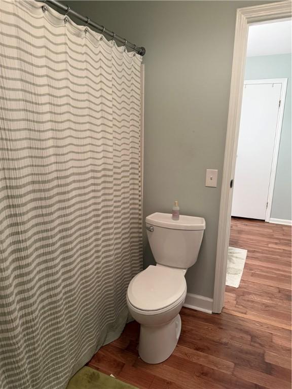 157 New Wickham Dr, Penfield, NY 14526 - bathroom with wood finished floors and a shower with curtain
