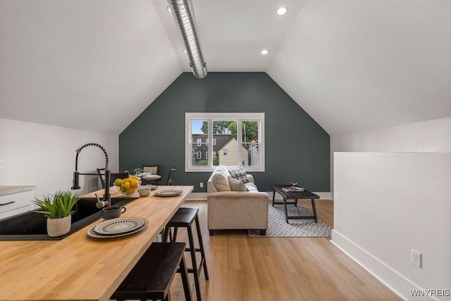 145 14th St, Buffalo, NY 14213 - dining space with light wood-style flooring and vaulted ceiling