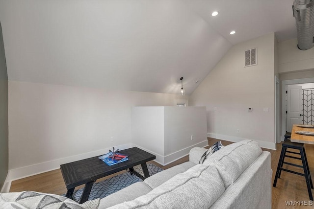 145 14th St, Buffalo, NY 14213 - living room featuring vaulted ceiling, recessed lighting, and wood finished floors