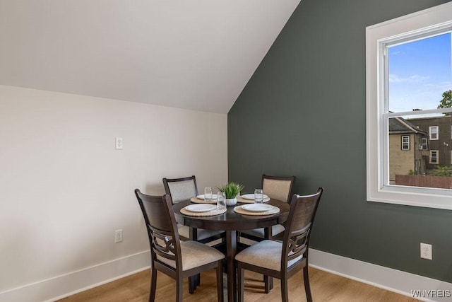 145 14th St, Buffalo, NY 14213 - dining area featuring wood finished floors and vaulted ceiling