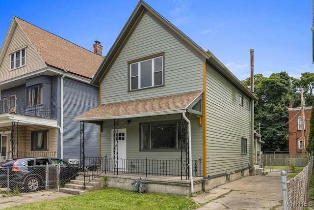 145 14th St, Buffalo, NY 14213 - view of front facade featuring covered porch, a chimney, and a shingled roof