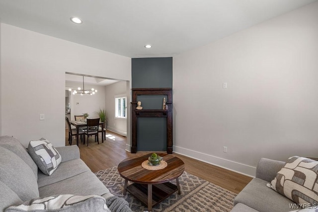 145 14th St, Buffalo, NY 14213 - living area with a chandelier, wood finished floors, and recessed lighting