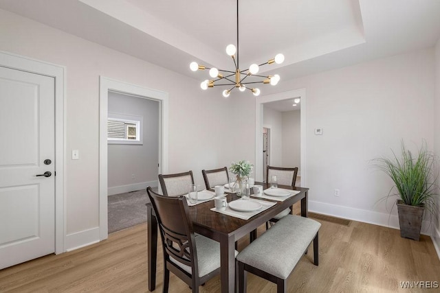 145 14th St, Buffalo, NY 14213 - dining space with light wood-type flooring and a chandelier