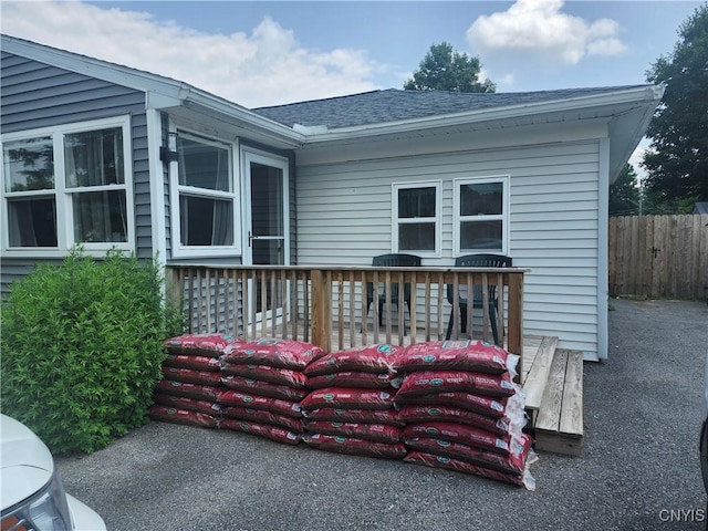 219 Camillus Dr, Camillus, NY 13031 - back of property with a wooden deck and a shingled roof