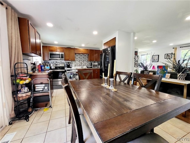 128 Dorando Way, Salina, NY 13090 - dining room featuring light tile patterned floors and recessed lighting