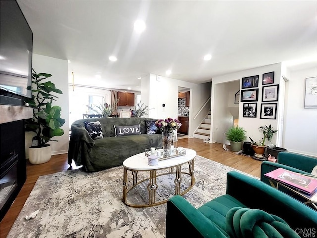 128 Dorando Way, Salina, NY 13090 - living area featuring stairs and wood finished floors