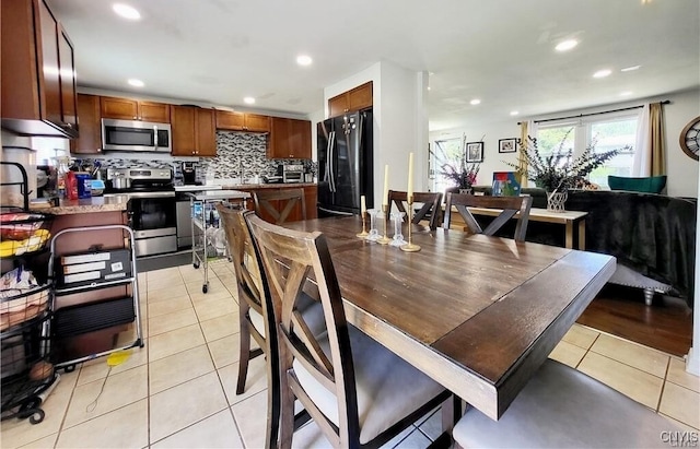 128 Dorando Way, Salina, NY 13090 - dining area featuring light tile patterned floors and recessed lighting