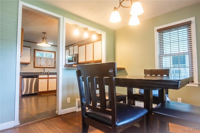 123 Branch St, Deerfield, NY 13502 - dining area with a chandelier and dark wood-style floors