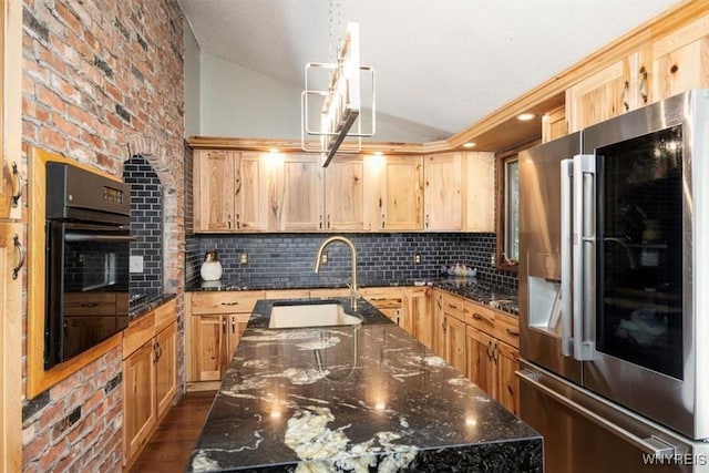 131 Shady Grove Dr, Amherst, NY 14051 - kitchen featuring stainless steel fridge with ice dispenser, oven, vaulted ceiling, a kitchen island with sink, and tasteful backsplash