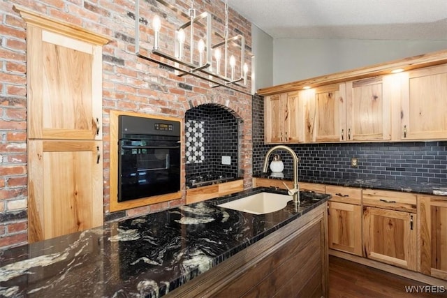 131 Shady Grove Dr, Amherst, NY 14051 - kitchen featuring oven, lofted ceiling, backsplash, dark wood finished floors, and dark stone countertops