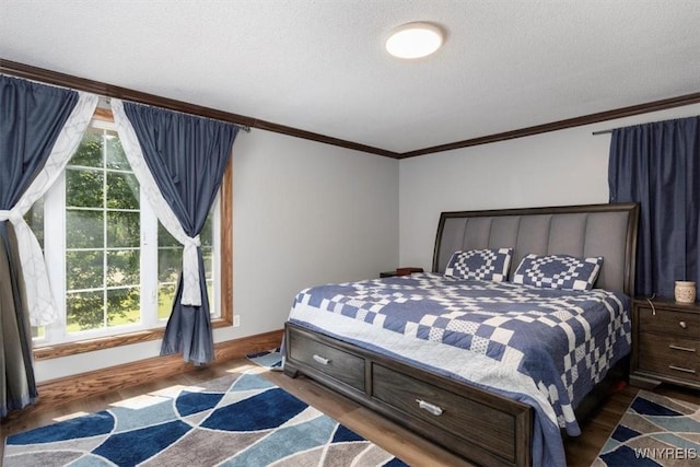 131 Shady Grove Dr, Amherst, NY 14051 - bedroom featuring crown molding, a textured ceiling, and wood finished floors