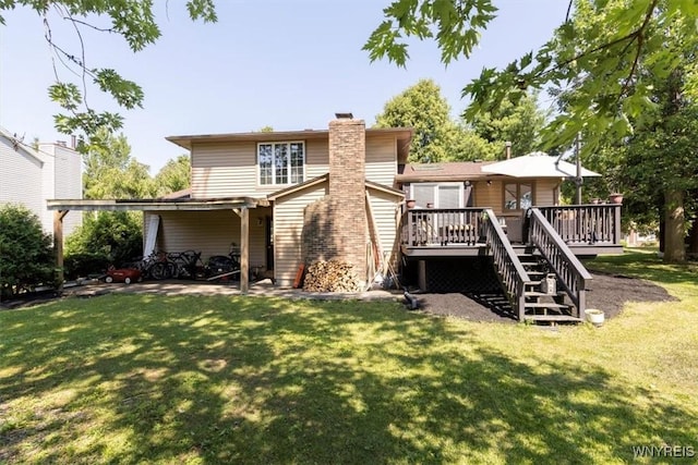131 Shady Grove Dr, Amherst, NY 14051 - rear view of house with a chimney, a lawn, a deck, and stairway