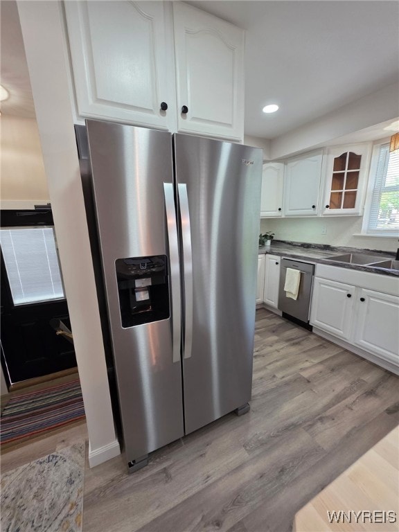 24 Wenonah, Tonawanda, NY 14150 - kitchen with appliances with stainless steel finishes, white cabinetry, light wood finished floors, glass insert cabinets, and recessed lighting