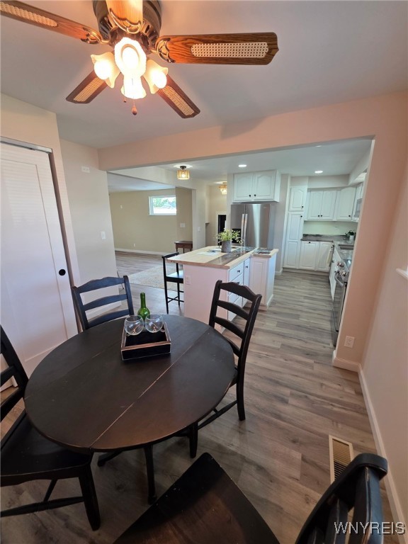24 Wenonah, Tonawanda, NY 14150 - dining area with ceiling fan and light wood-style floors