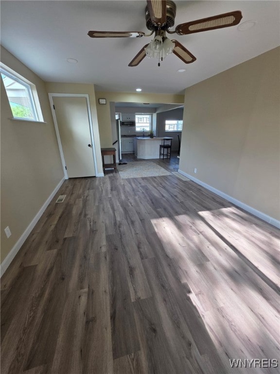 24 Wenonah, Tonawanda, NY 14150 - unfurnished living room featuring a ceiling fan, dark wood-type flooring, and recessed lighting
