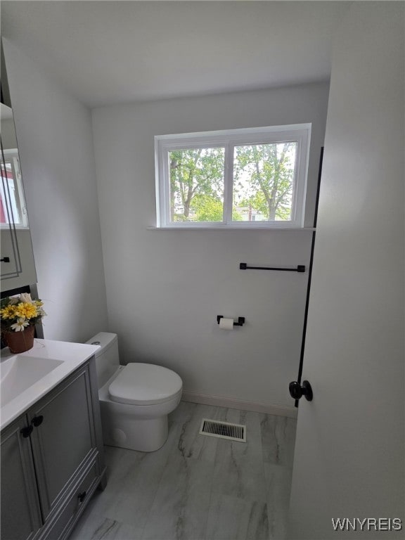 24 Wenonah, Tonawanda, NY 14150 - half bath with marble look tile flooring, plenty of natural light, and vanity