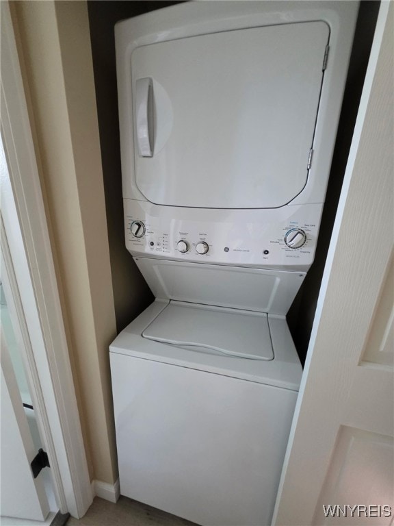 24 Wenonah, Tonawanda, NY 14150 - laundry room featuring stacked washing machine and dryer