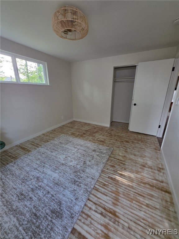 24 Wenonah, Tonawanda, NY 14150 - unfurnished bedroom featuring a closet and wood finished floors