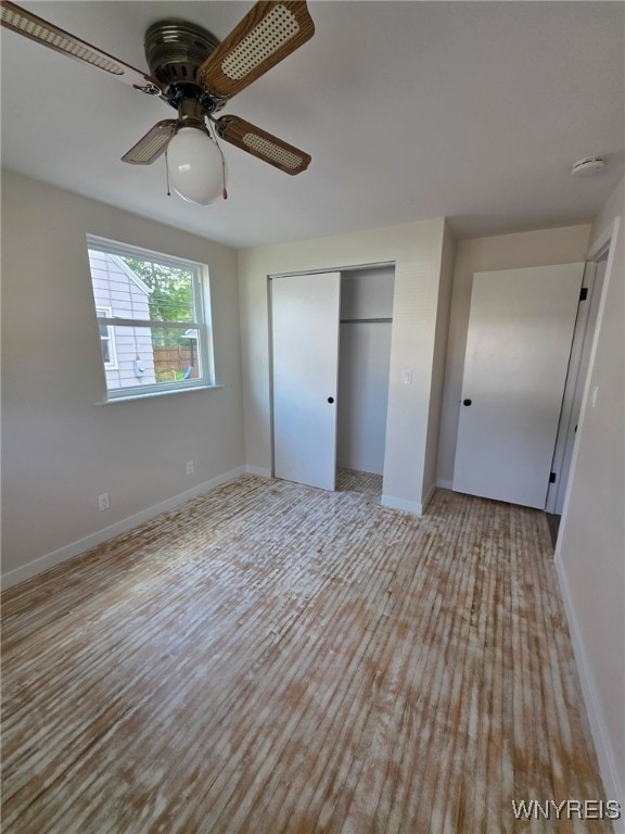 24 Wenonah, Tonawanda, NY 14150 - unfurnished bedroom with wood finished floors, a closet, and ceiling fan
