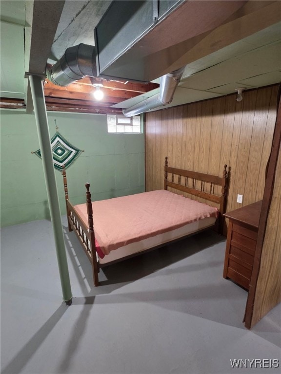 24 Wenonah, Tonawanda, NY 14150 - bedroom featuring concrete floors and wood walls