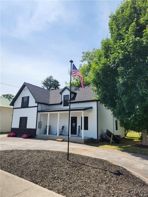 8457 S Main St, Le Ray, NY 13637 - view of front facade featuring covered porch and a shingled roof
