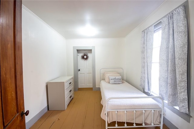 345 Dorr Edson Rd, Milford, NY 13820 - bedroom with light wood finished floors and ornamental molding
