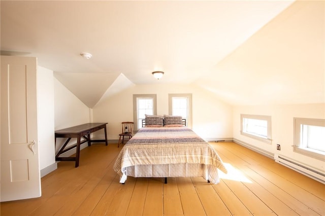 345 Dorr Edson Rd, Milford, NY 13820 - bedroom featuring baseboard heating, light wood-style floors, multiple windows, and lofted ceiling
