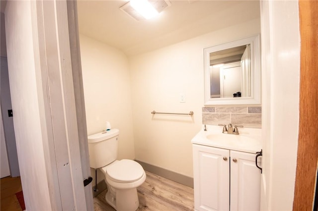 345 Dorr Edson Rd, Milford, NY 13820 - bathroom featuring vanity, wood finished floors, and decorative backsplash