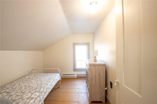 345 Dorr Edson Rd, Milford, NY 13820 - bedroom with a baseboard radiator, hardwood / wood-style floors, and vaulted ceiling