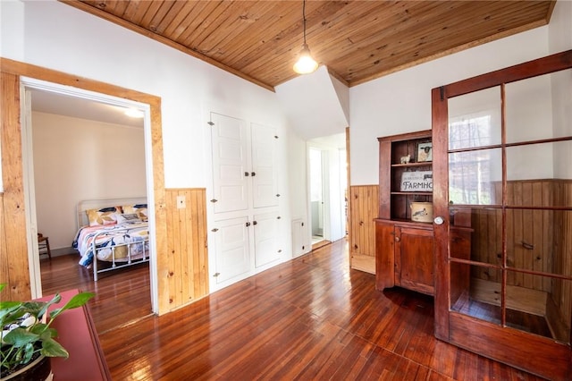 345 Dorr Edson Rd, Milford, NY 13820 - interior space with wainscoting, dark wood-style floors, wooden ceiling, wood walls, and ornamental molding
