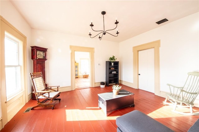 345 Dorr Edson Rd, Milford, NY 13820 - living area featuring wood-type flooring and a chandelier