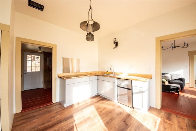 345 Dorr Edson Rd, Milford, NY 13820 - kitchen with refrigerator, light wood finished floors, light countertops, and white cabinetry