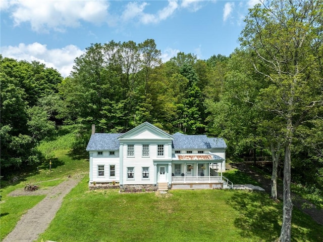 345 Dorr Edson Rd, Milford, NY 13820 - view of front of home with covered porch, dirt driveway, a front yard, and a chimney