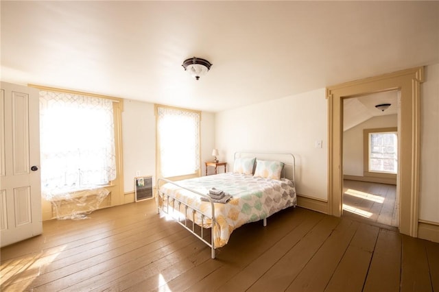 345 Dorr Edson Rd, Milford, NY 13820 - bedroom featuring heating unit and wood-type flooring