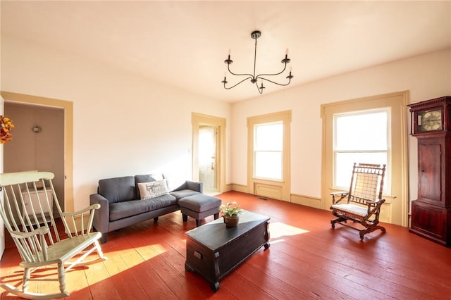 345 Dorr Edson Rd, Milford, NY 13820 - living room featuring hardwood / wood-style floors and a chandelier