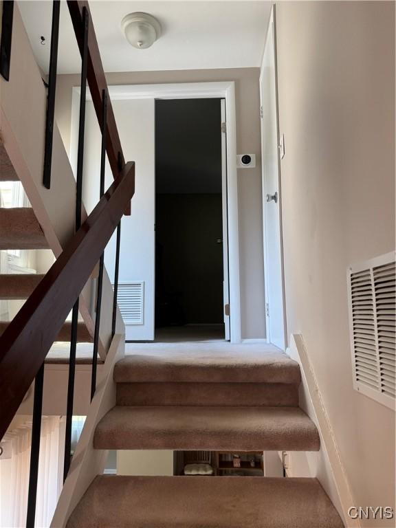 601 Woburn Dr, Camillus, NY 13031 - stairs featuring carpet flooring