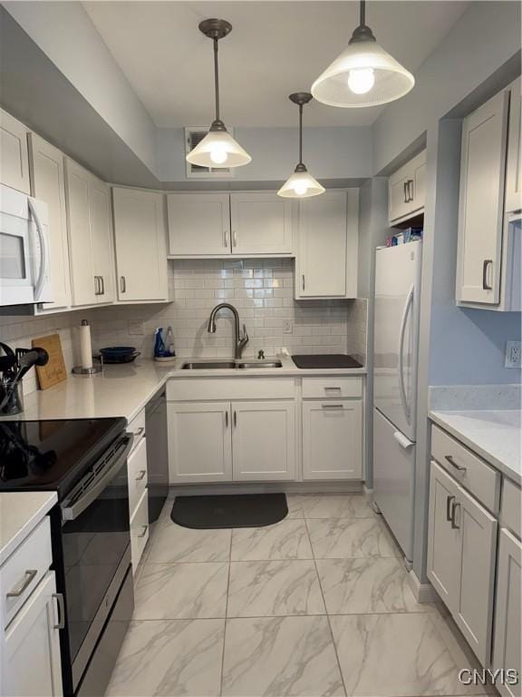 601 Woburn Dr, Camillus, NY 13031 - kitchen with white appliances, light marble finish floors, light countertops, tasteful backsplash, and pendant lighting