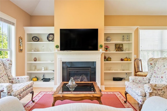 1100 Yorkshire Way, Victor, NY 14564 - living room featuring wood finished floors and a glass covered fireplace