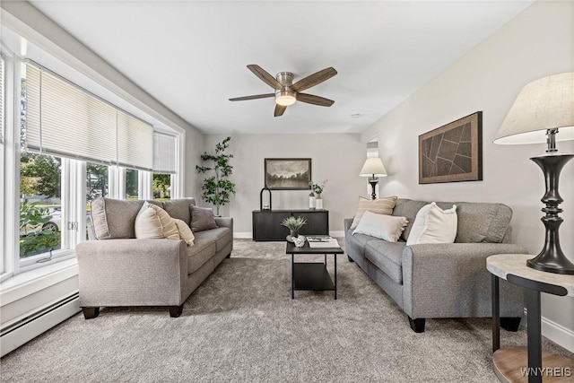 87 Ermann Dr, Tonawanda, NY 14217 - living room with a baseboard heating unit, light carpet, and ceiling fan