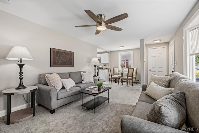 87 Ermann Dr, Tonawanda, NY 14217 - living room with light carpet and a ceiling fan