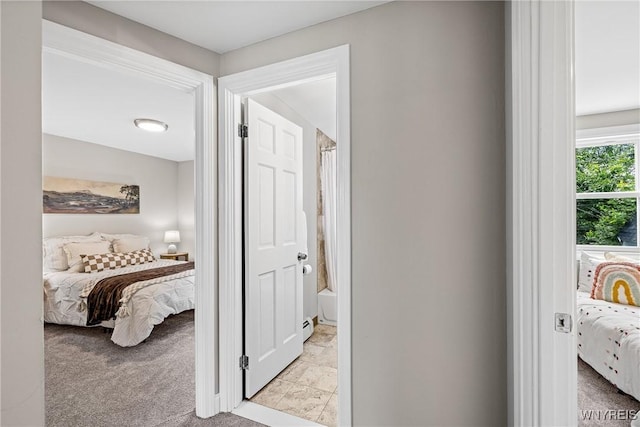87 Ermann Dr, Tonawanda, NY 14217 - corridor featuring light colored carpet and baseboard heating